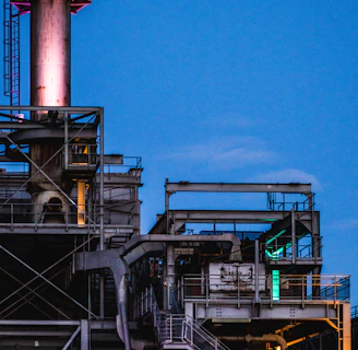 photography of black metal industrial factory