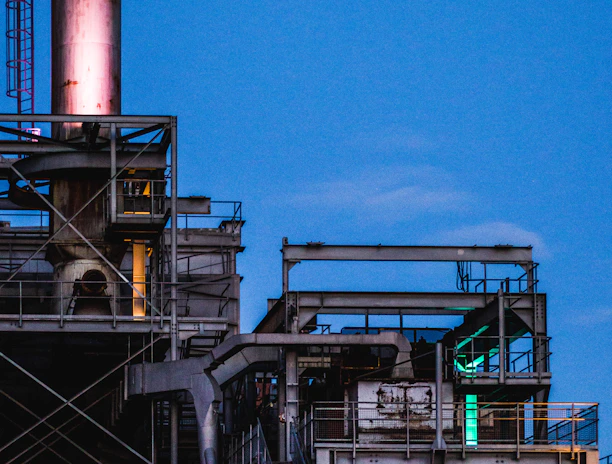 photography of black metal industrial factory