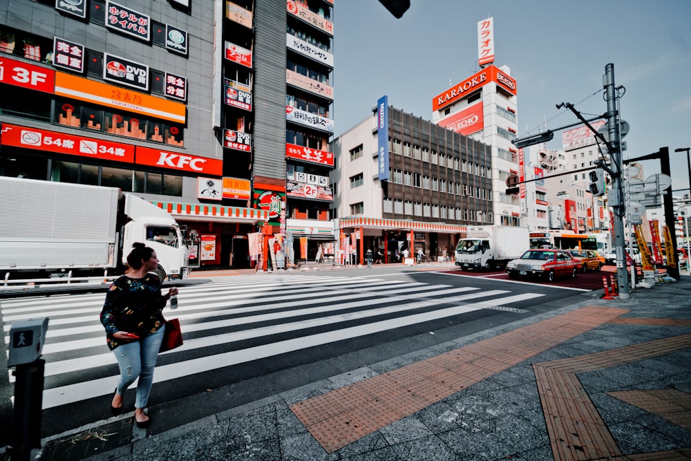 woman walking on pedestrian lane