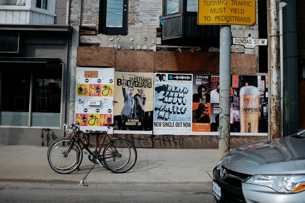 black bike in front of storefront