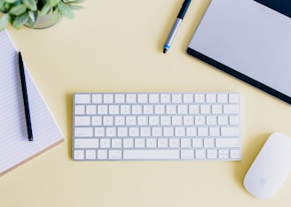 a keyboard and a mouse on a desk