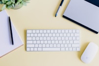 a keyboard and a mouse on a desk
