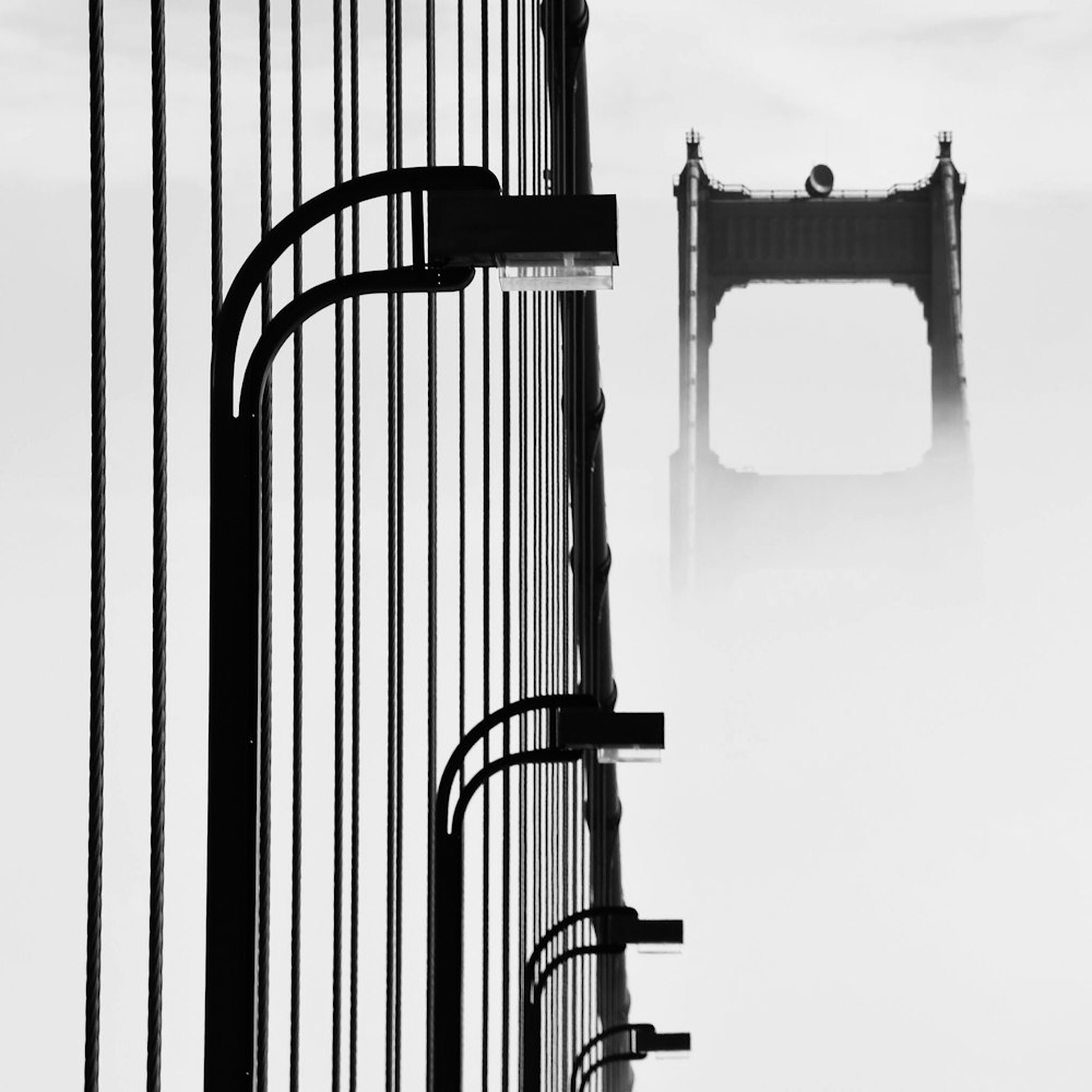 a black and white photo of a gate