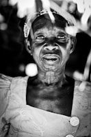 Black and white artistic portrait highlighting elegant draping and delicate detailing of sevnian clothing.