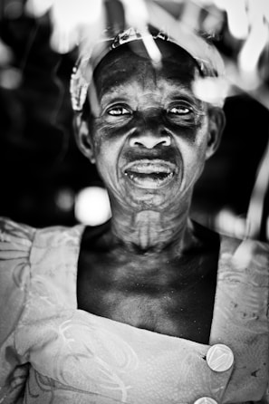 Black and white artistic portrait highlighting elegant draping and delicate detailing of sevnian clothing.