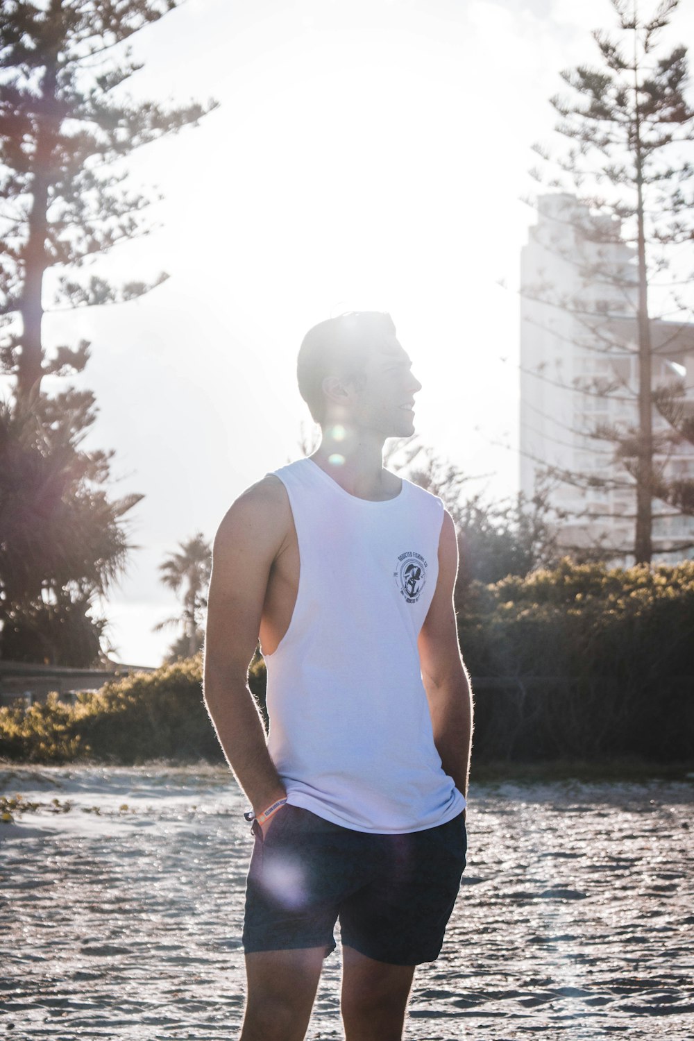 man standing near lake