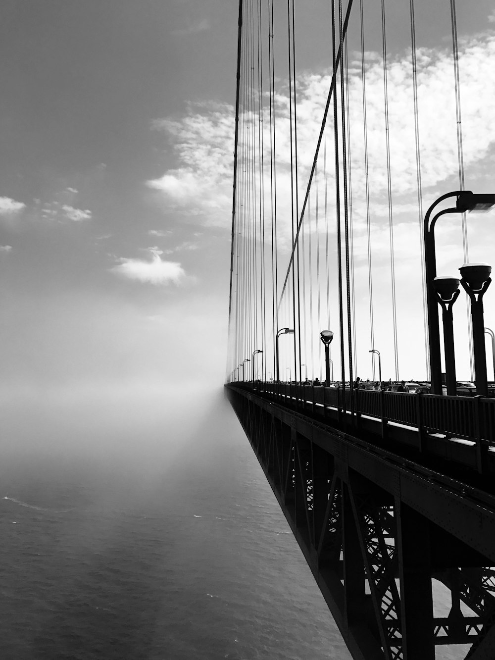 grayscale photography of cable bridge