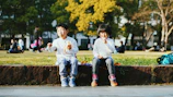 Children enjoying freshly prepared snacks under a sunny sky.