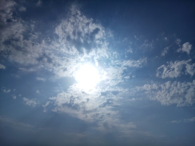 Bright sunspots scattered across the sun's glowing surface.