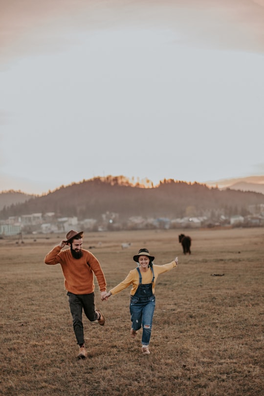 man holdind woman hand in Bakuriani Georgia