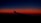 A dark blue sky transitions into a vibrant orange and red horizon, with the silhouette of an airplane wing visible in the foreground.