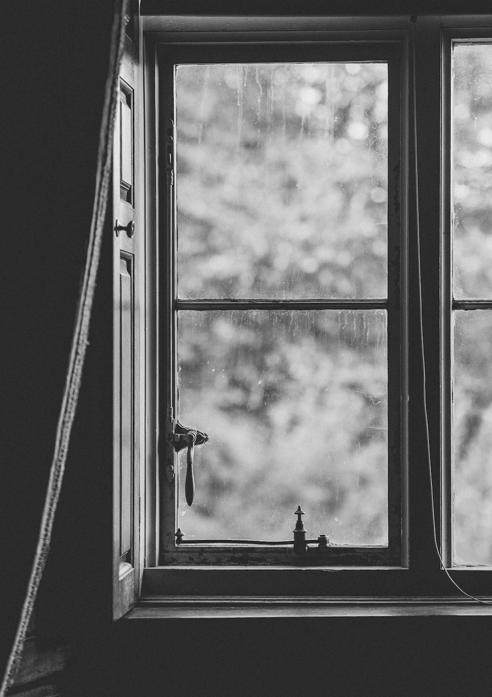grayscale photo of framed window