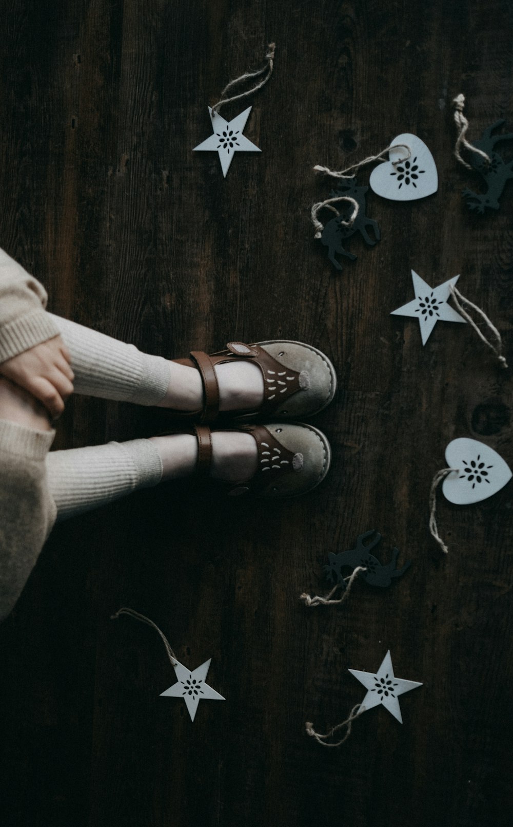 person standing near star and heart decors