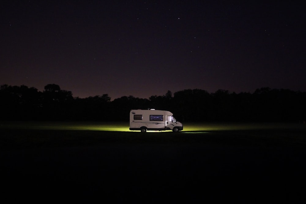 white RV at the road during night