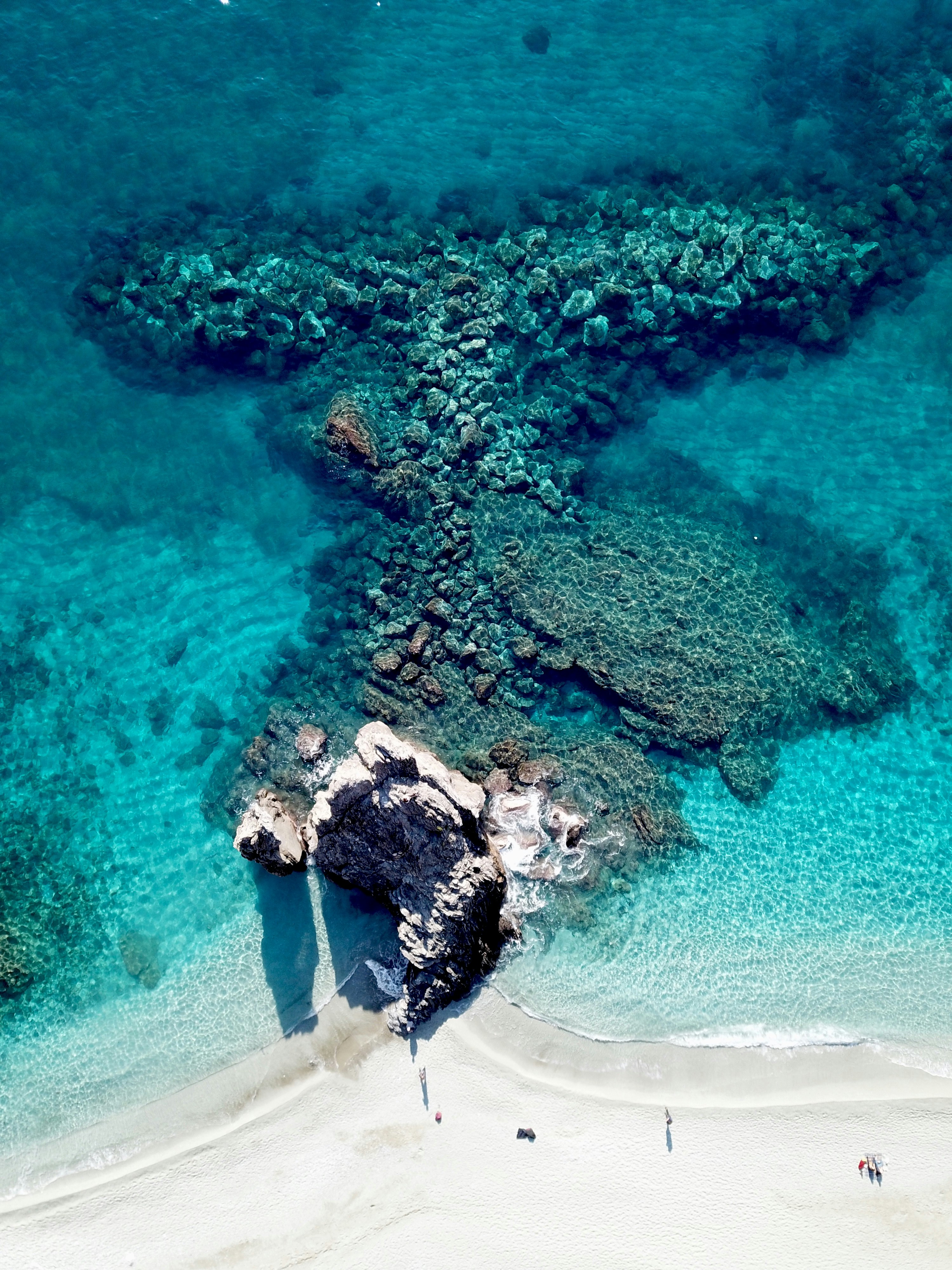 bird's eye view photography of white sand seashore