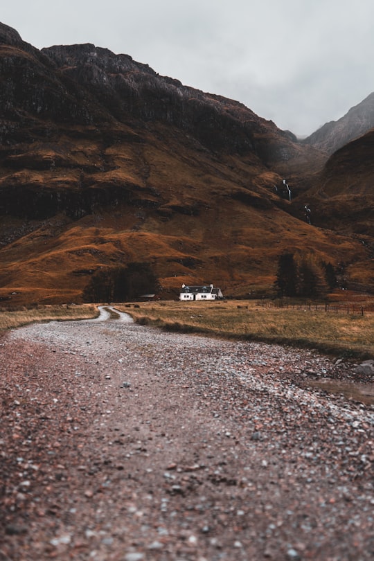 road leading house on hillside in Loch Achtriochtan, Glencoe United Kingdom