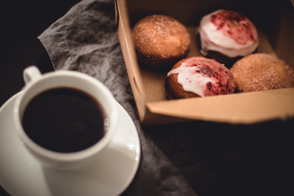 white teacup near bread