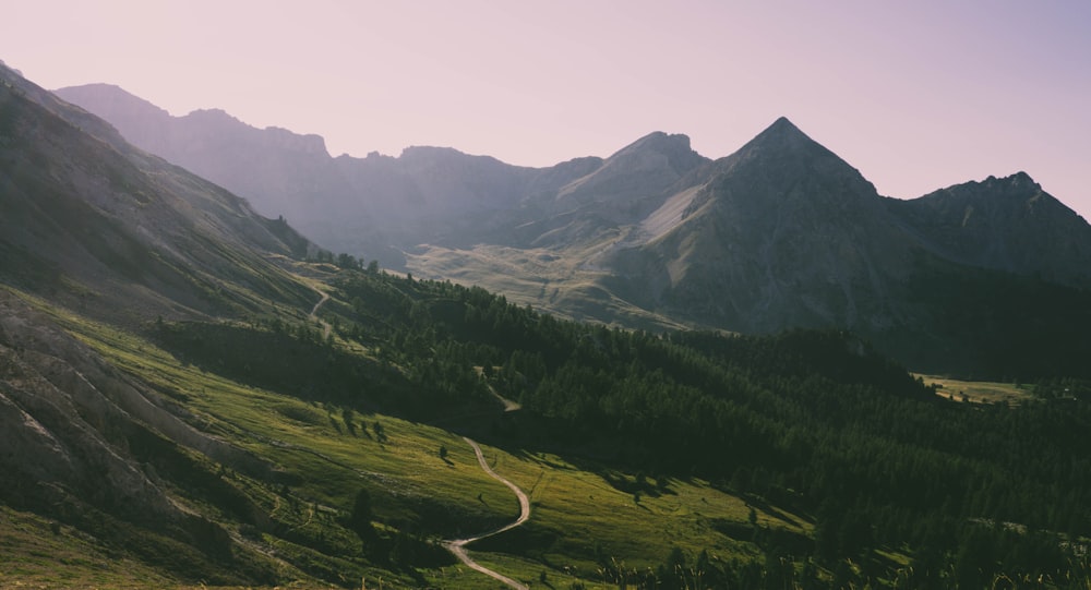 mountain ranges under cloudy sky during daytime