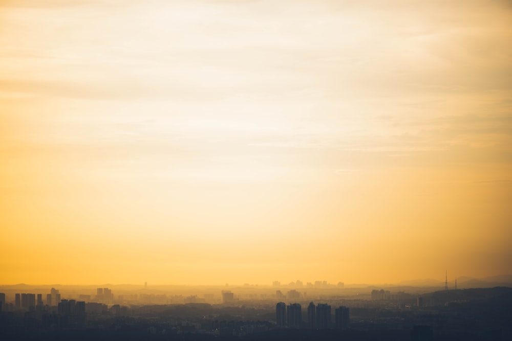 buildings under cloudy sky at daytime