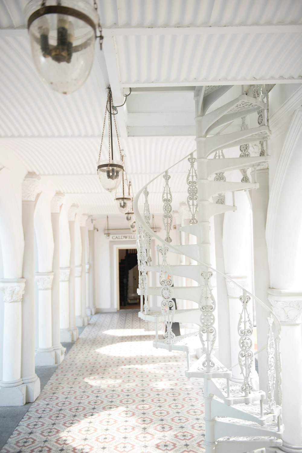 white hallway with ladder
