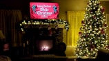 A cozy living room featuring various holiday decorations.