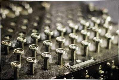 Close-up of new keys being cut on a professional key machine.