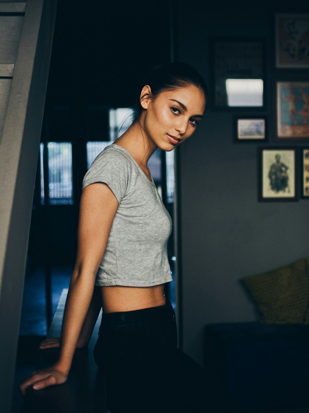 woman holding table standing near door