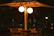 A serene backyard scene with uniglo’s elegant outdoor chairs and table under string lights.