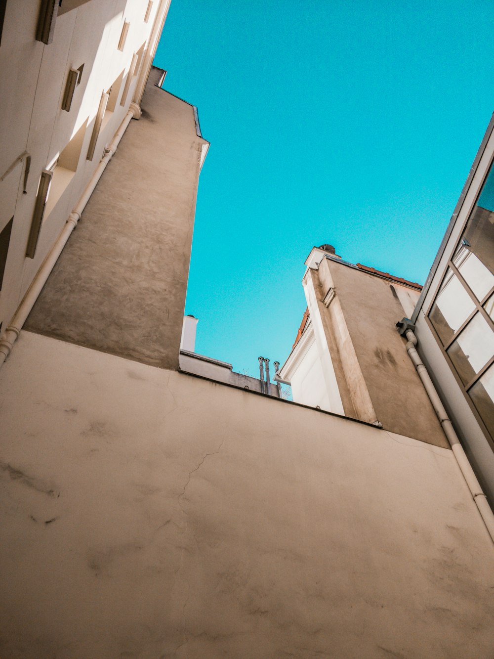 low angle photograph of white concrete structures