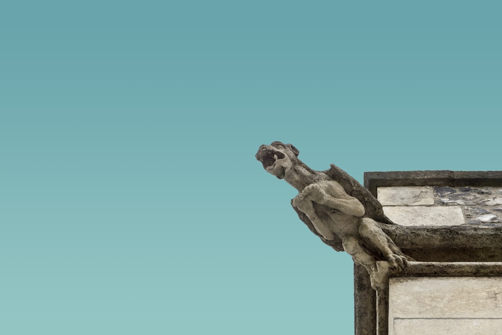 concrete gargoyle on structure edge