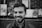 grayscale of man smiling