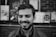 grayscale of man smiling