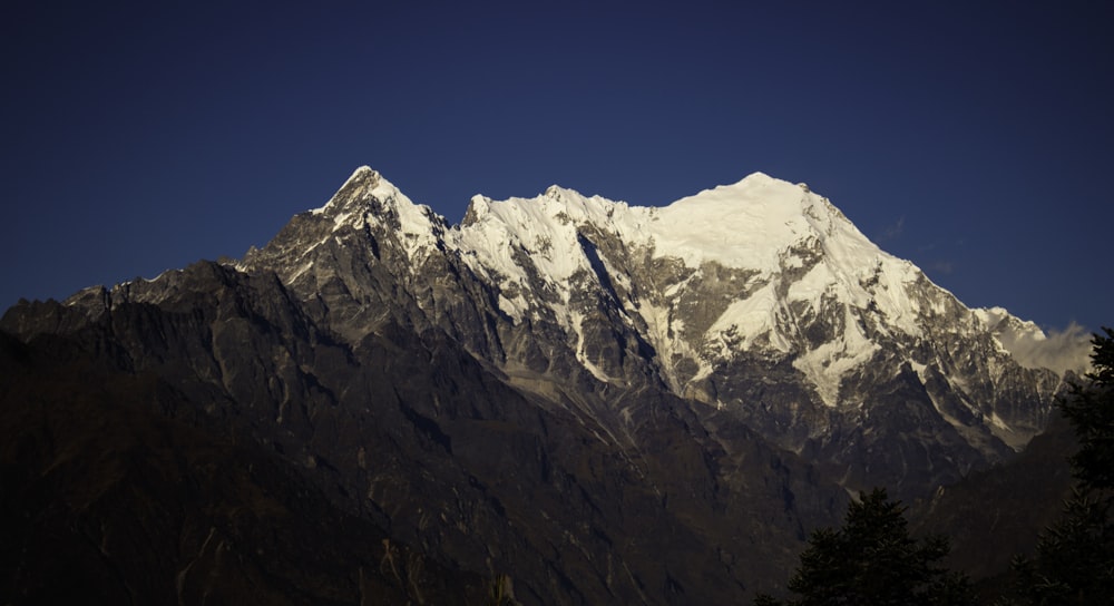 snow capped mountain under blue sky