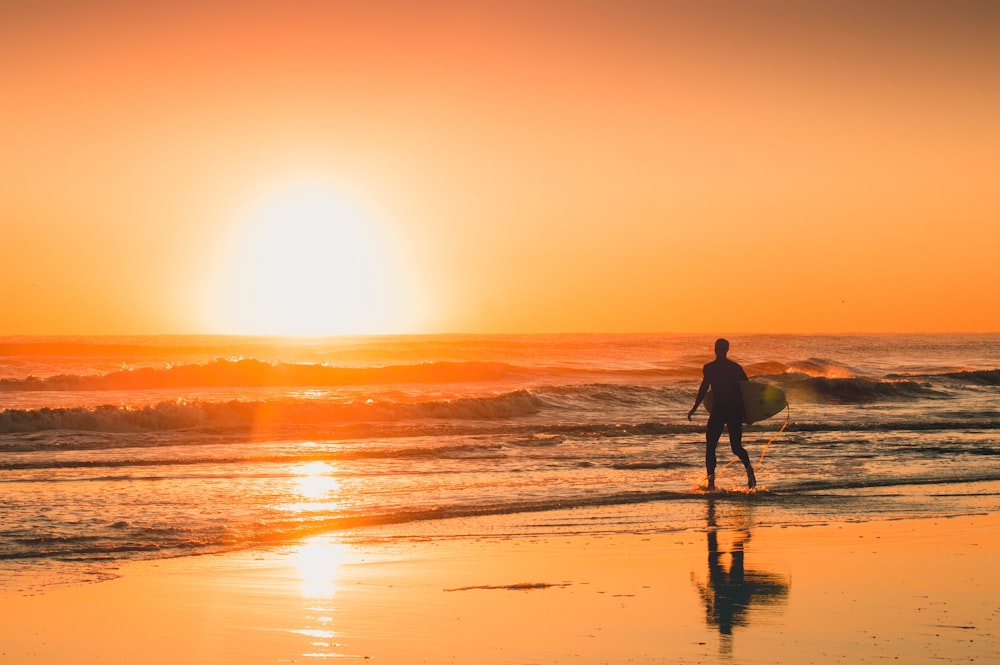 man beside body of water