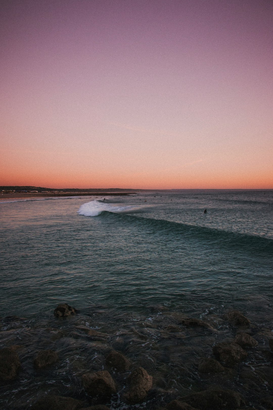 person surfing on body of water