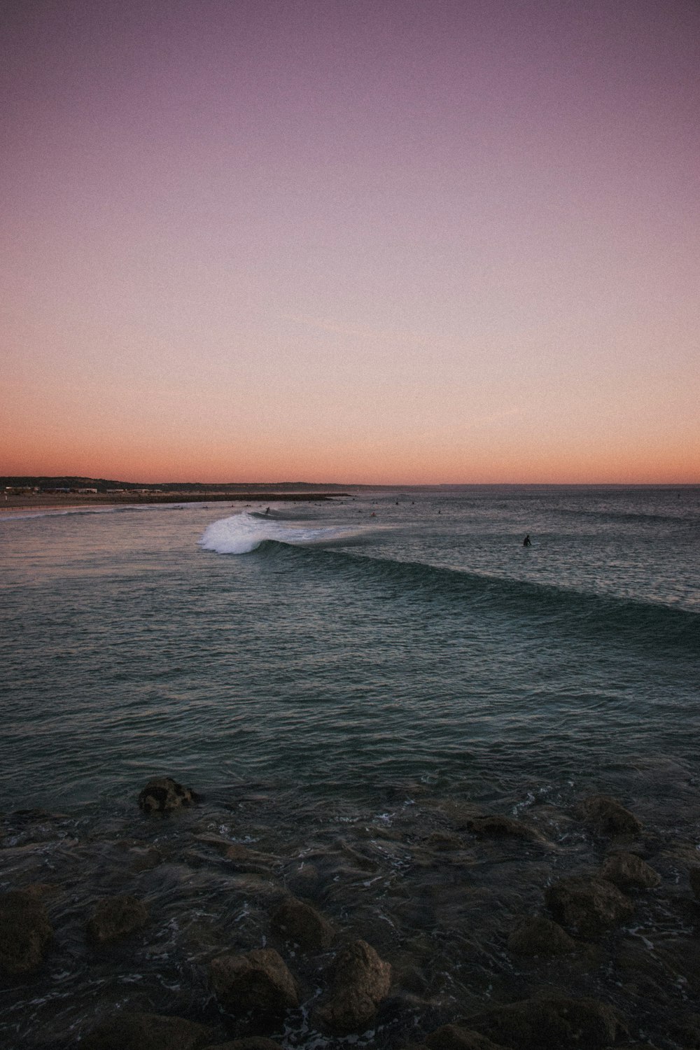 person surfing on body of water