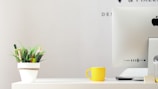 A workspace featuring minimalistic gadgets and decor.