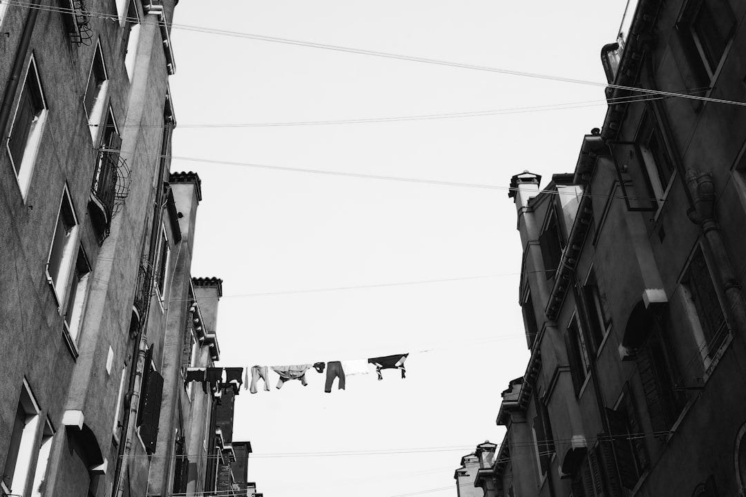 grayscale low angle photo of concrete buildings