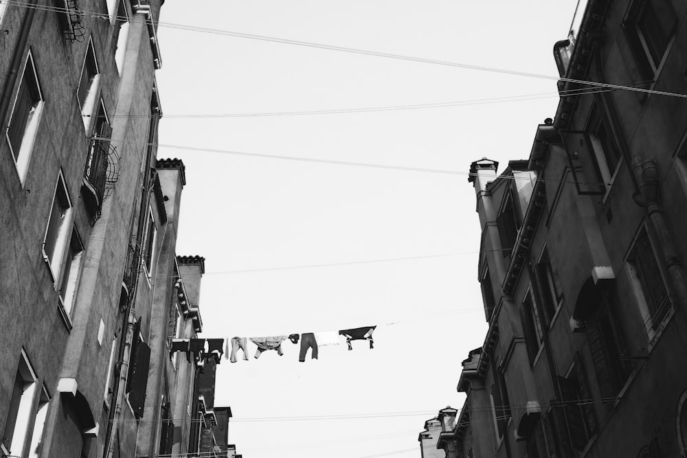 grayscale low angle photo of concrete buildings