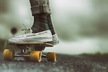 person standing on skateboard during daytime