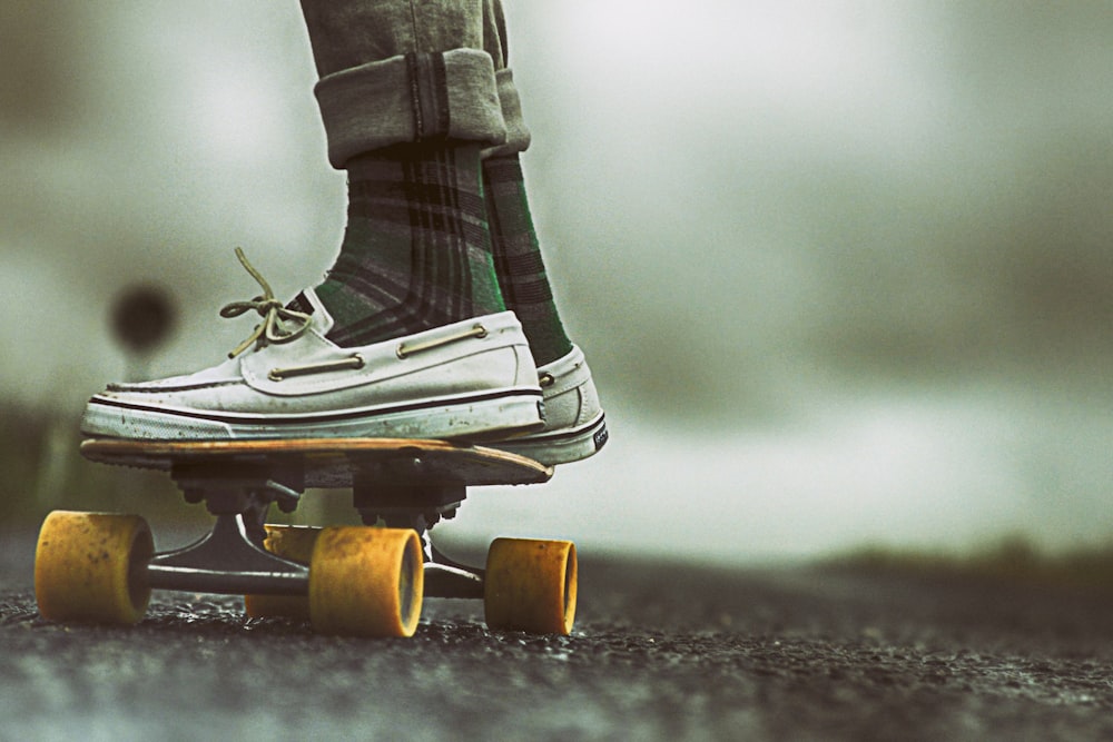 person standing on skateboard during daytime