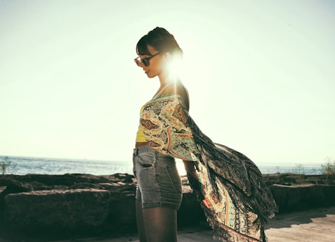 woman wearing beige and black paisley top