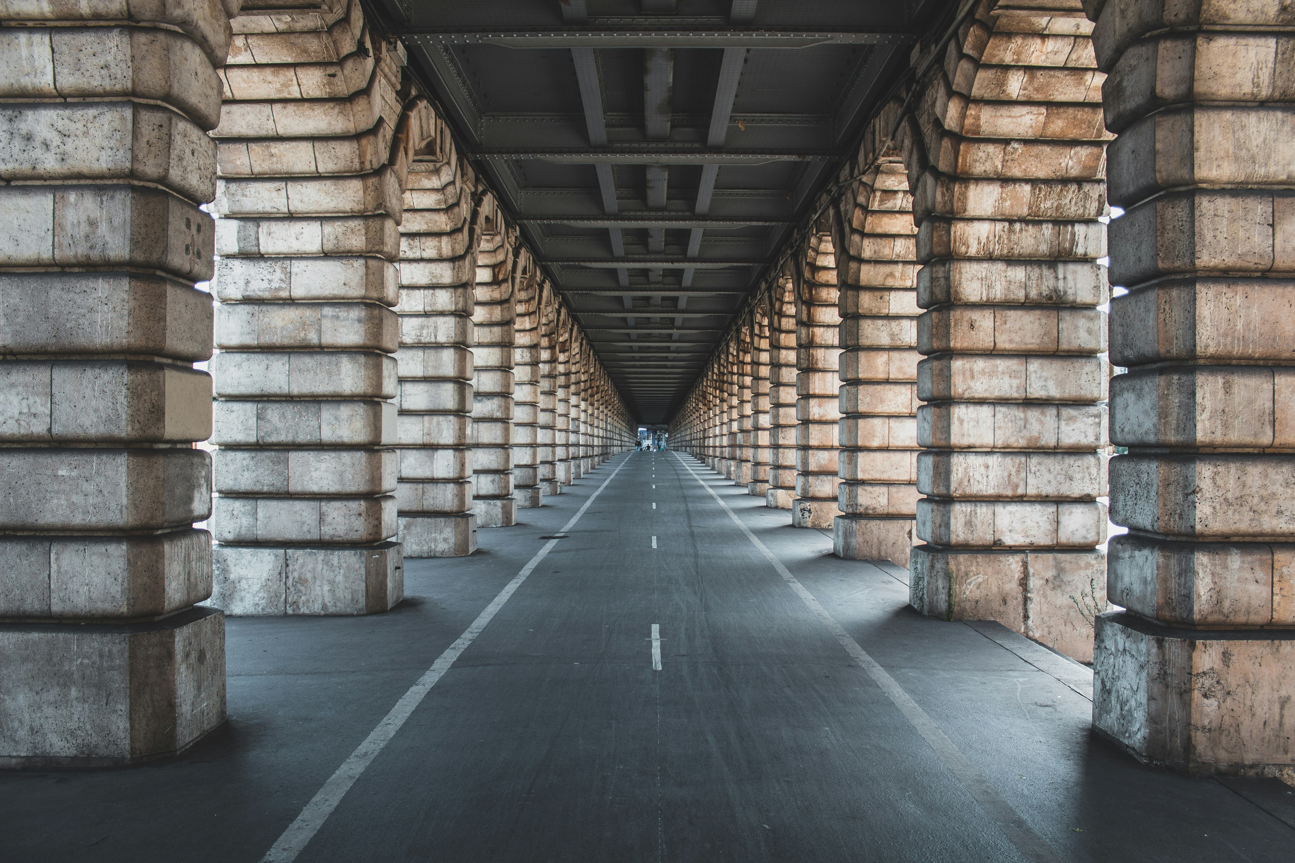 road between brown panels during daytime