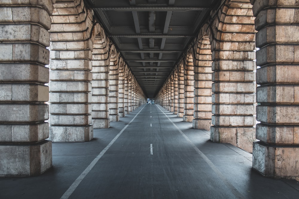 road between brown panels during daytime