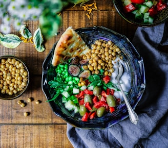 mix of veggies and chickpeas in a dark bowl