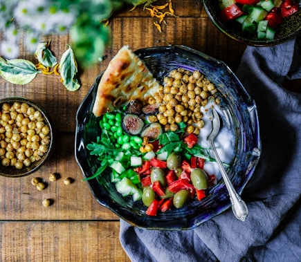 mix of veggies and chickpeas in a dark bowl