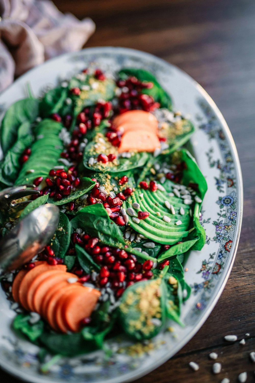 oval ceramic plate with and green and orange food