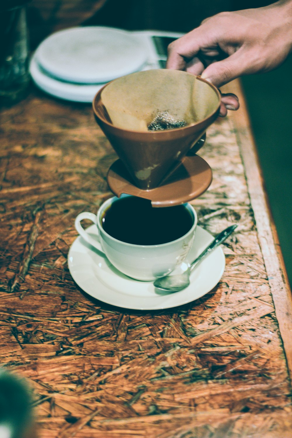 person holding coffee filter