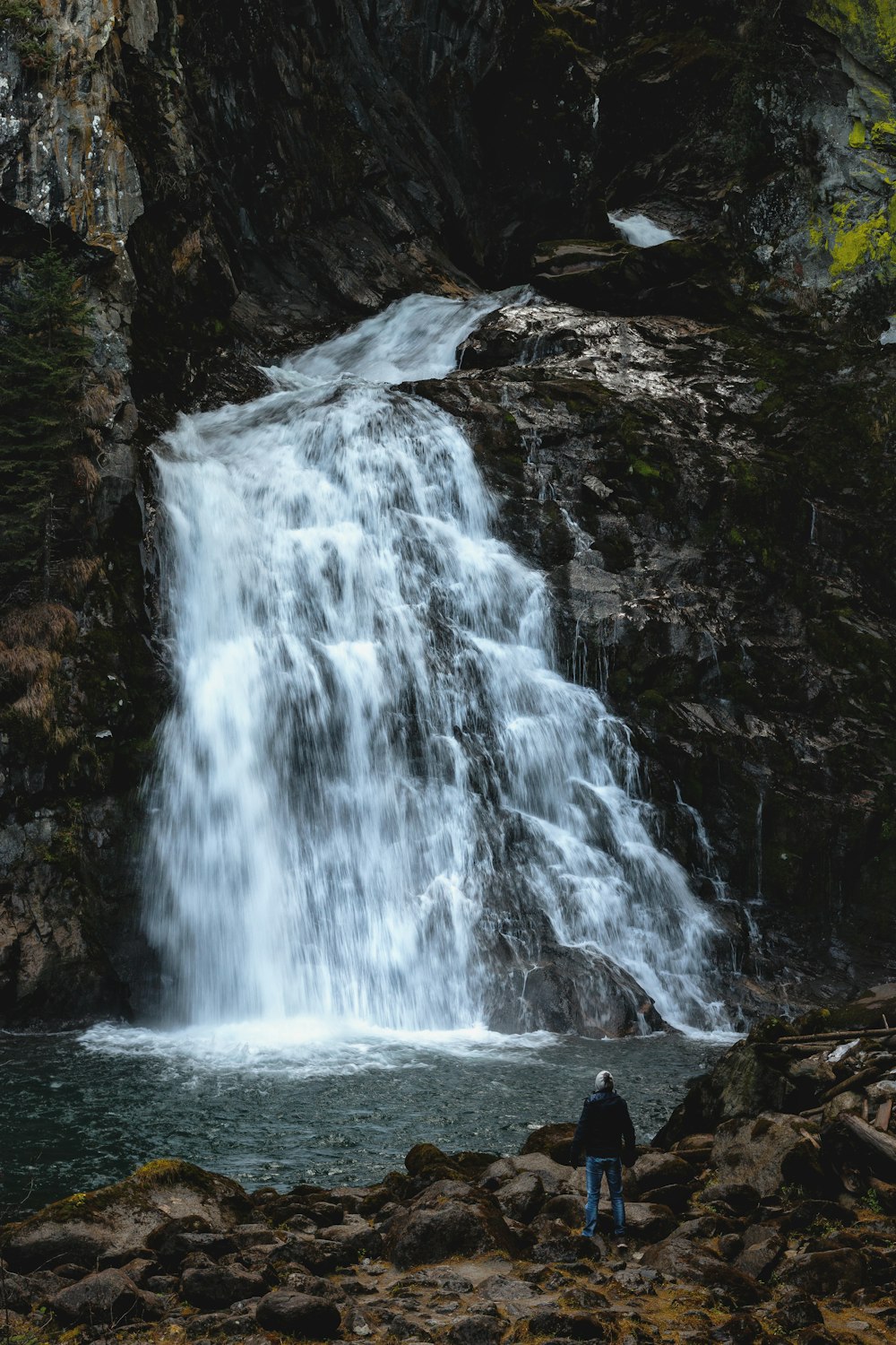 person in-front waterfalls