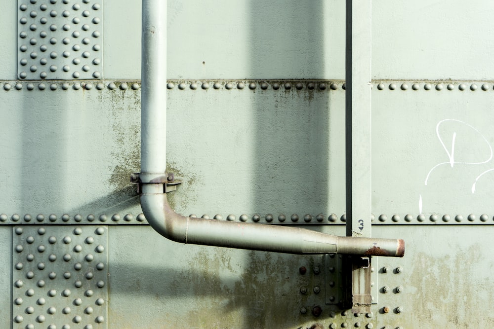 white steel water pipe during daytime